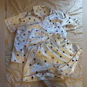 White pajama set, multi colored hearts Include button up top and short setSize L